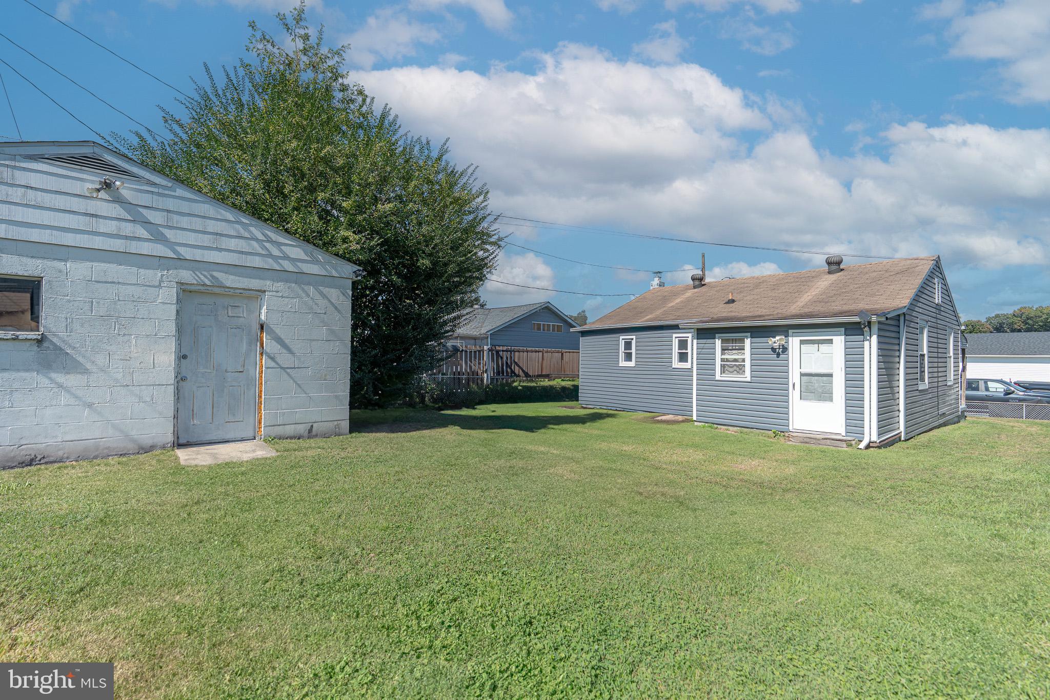 53 Chandelle Road Baltimore, MD 21220 - Photo 12 of 15 a view of a house with a yard