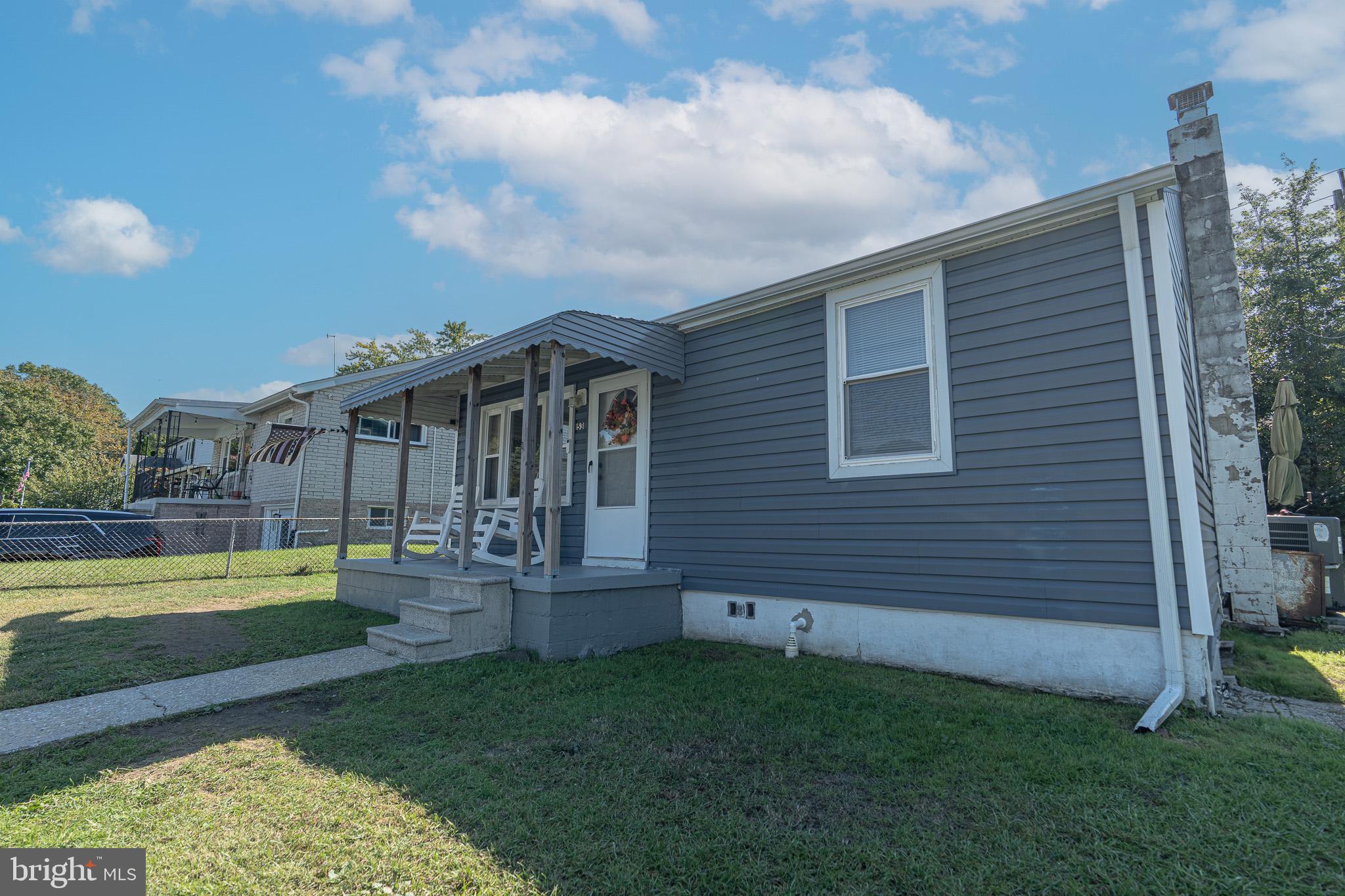 53 Chandelle Road Baltimore, MD 21220 - Photo 14 of 15 a view of a house with backyard and sitting area
