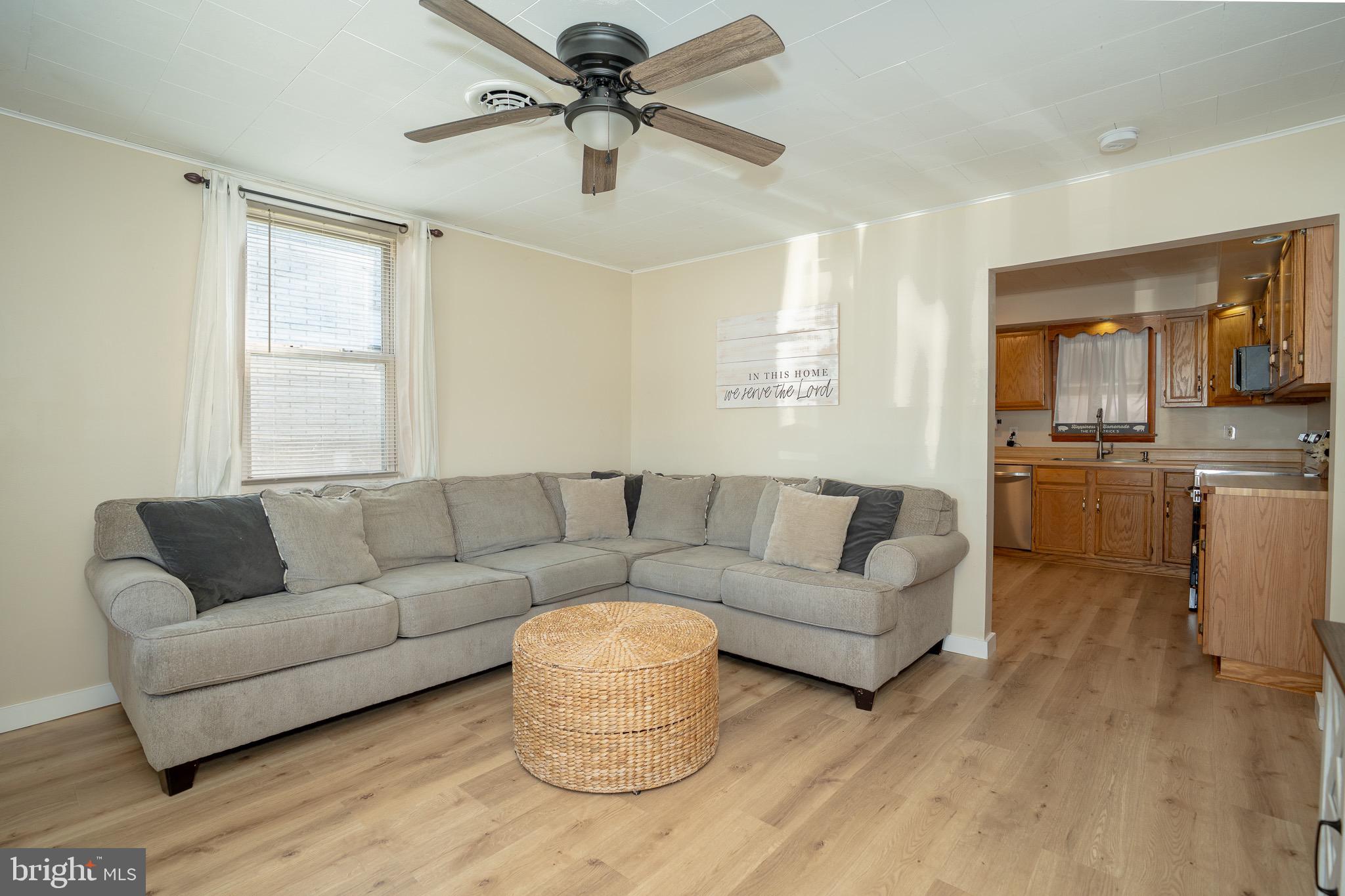53 Chandelle Road Baltimore, MD 21220 - Photo 2 of 15 a living room with furniture and a window
