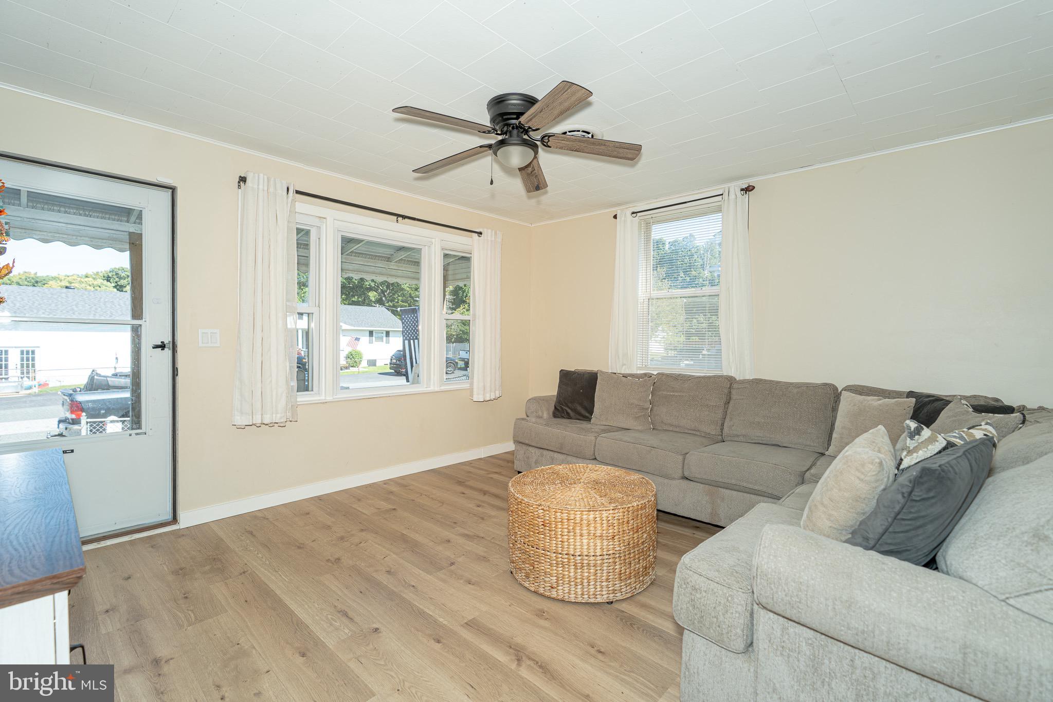 53 Chandelle Road Baltimore, MD 21220 - Photo 3 of 15 a living room with furniture and a large window