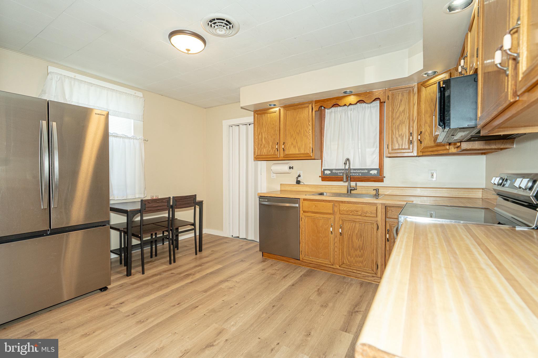 53 Chandelle Road Baltimore, MD 21220 - Photo 4 of 15 a kitchen with a sink appliances and cabinets