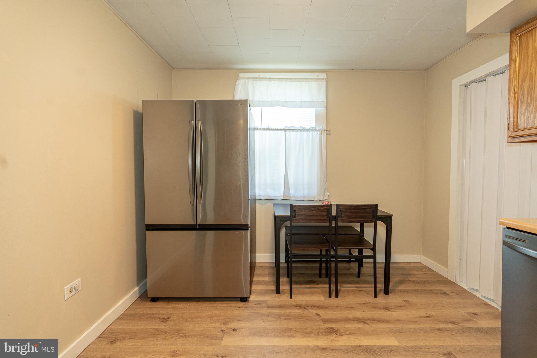 53 Chandelle Road Baltimore, MD 21220 - Photo 7 of 15 a view of a workspace with furniture and a window