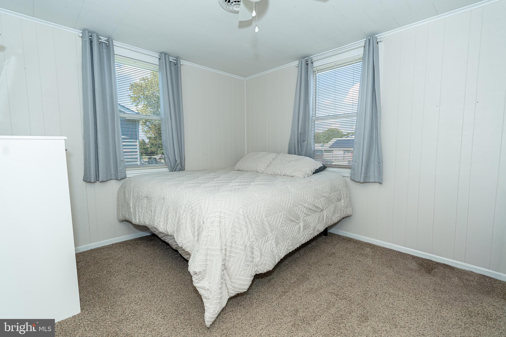 53 Chandelle Road Baltimore, MD 21220 - Photo 8 of 15 a bedroom with a bed and window