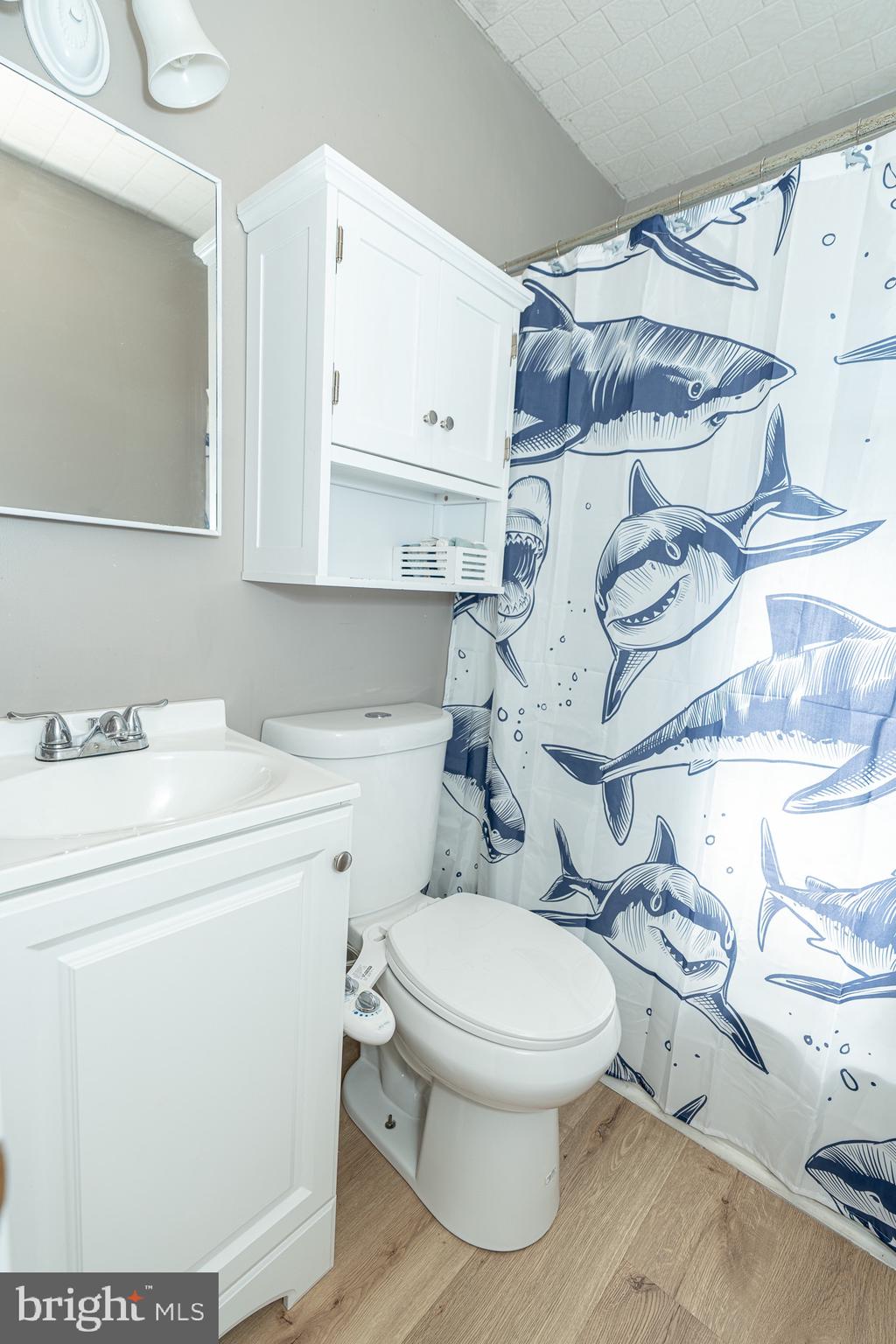 53 Chandelle Road Baltimore, MD 21220 - Photo 10 of 15 a white toilet sitting next to a bathroom sink and vanity