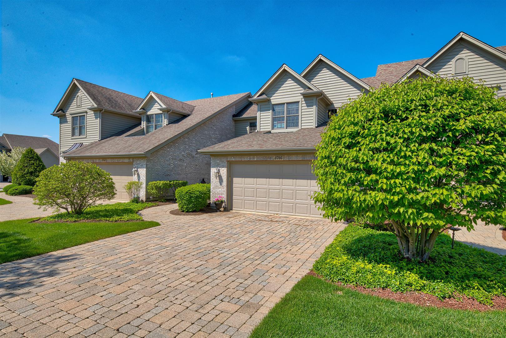 3705 Ridge Pointe Drive Geneva, IL 60134 - Photo 2 of 35 a front view of a house with a yard and garage