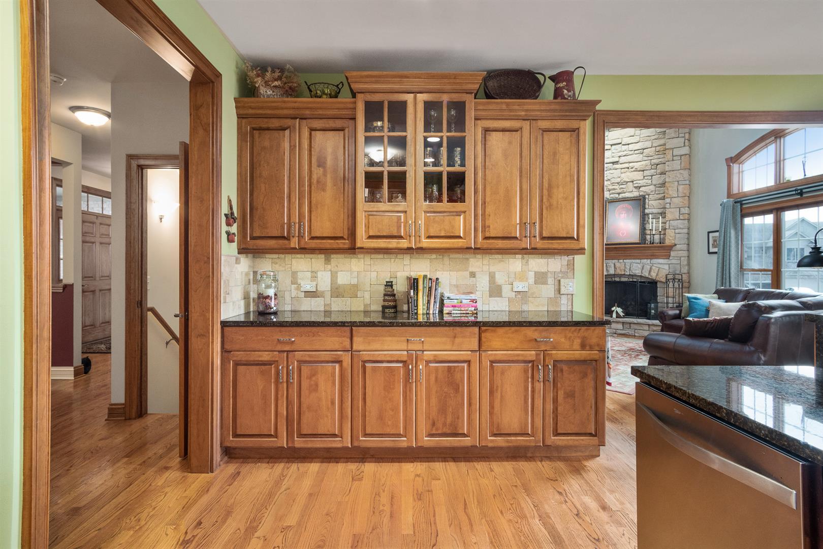 3705 Ridge Pointe Drive Geneva, IL 60134 - Photo 11 of 35 a kitchen with stainless steel appliances granite countertop a stove a sink and a refrigerator