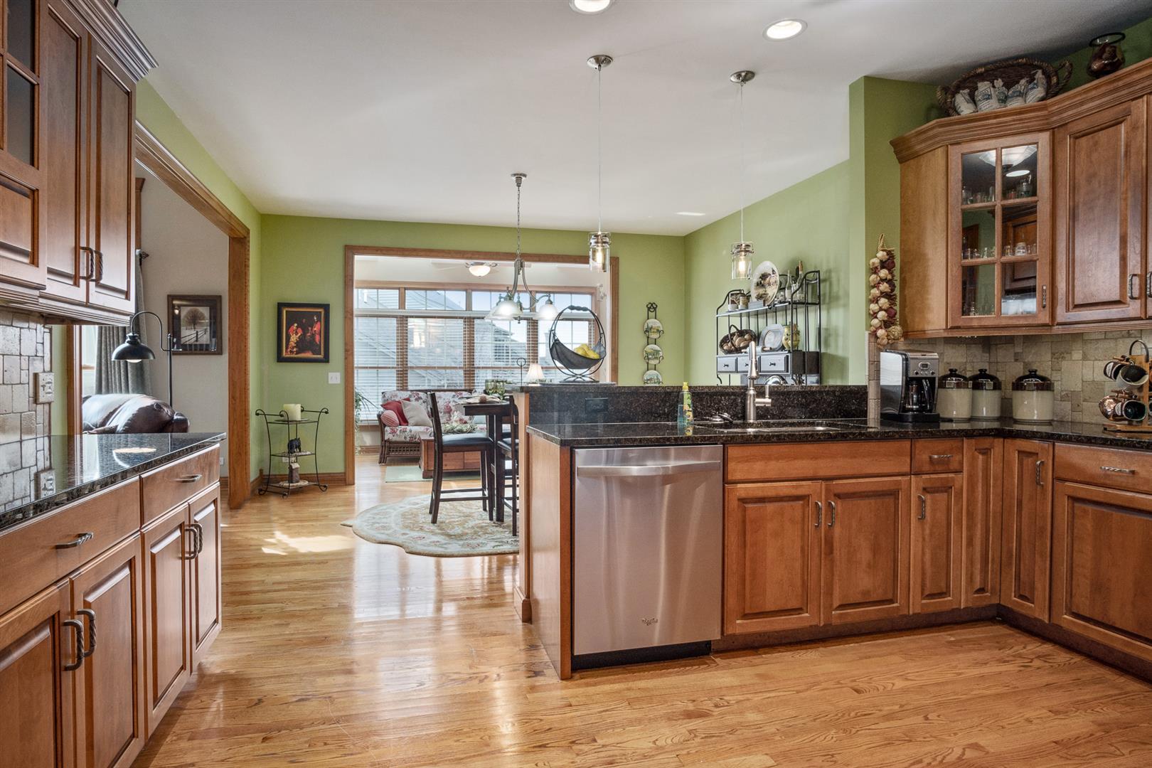 3705 Ridge Pointe Drive Geneva, IL 60134 - Photo 13 of 35 a kitchen with lots of counter top space and painting on the wall