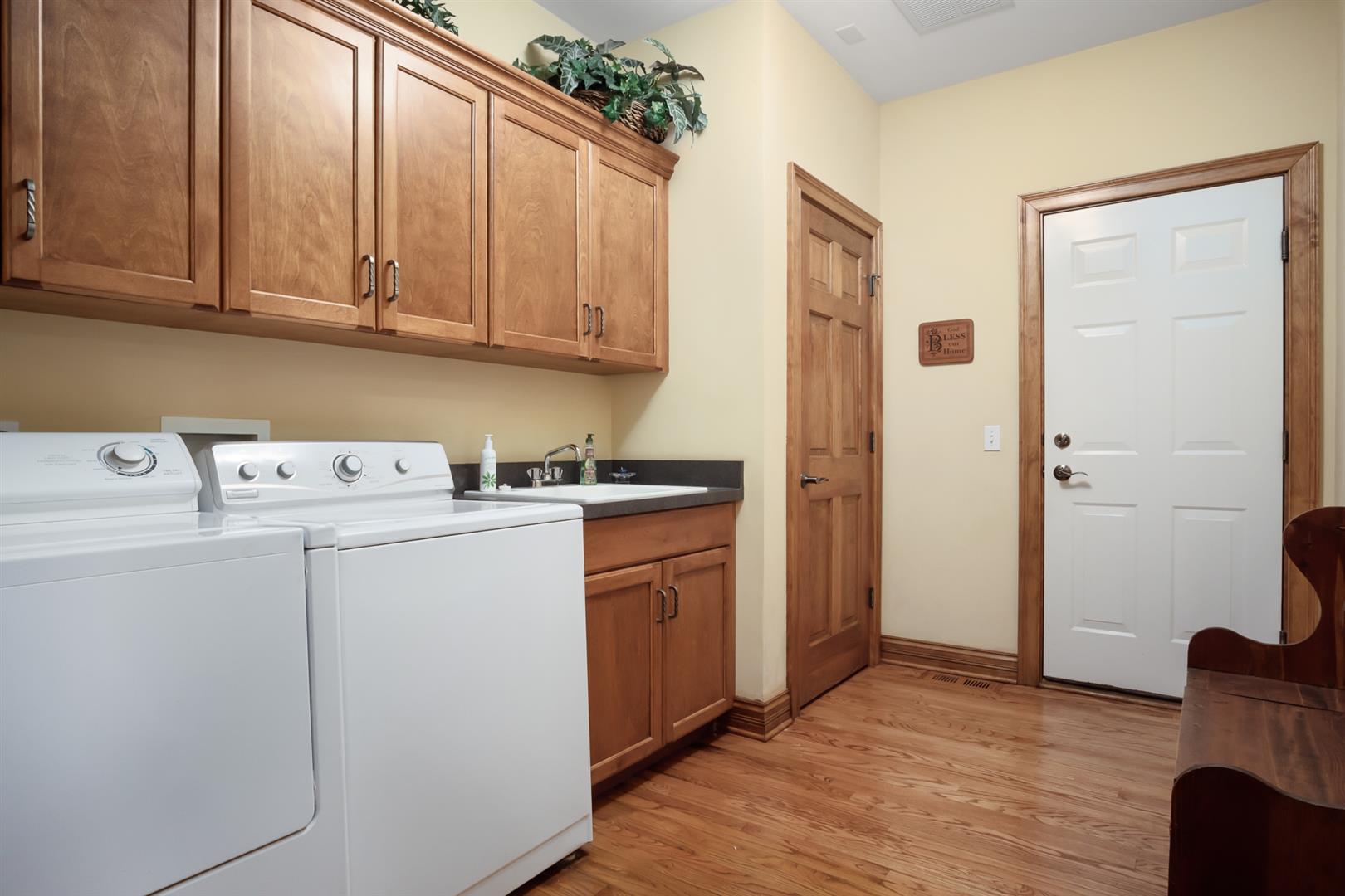 3705 Ridge Pointe Drive Geneva, IL 60134 - Photo 18 of 35 a view of a storage and utility room with washer and dryer