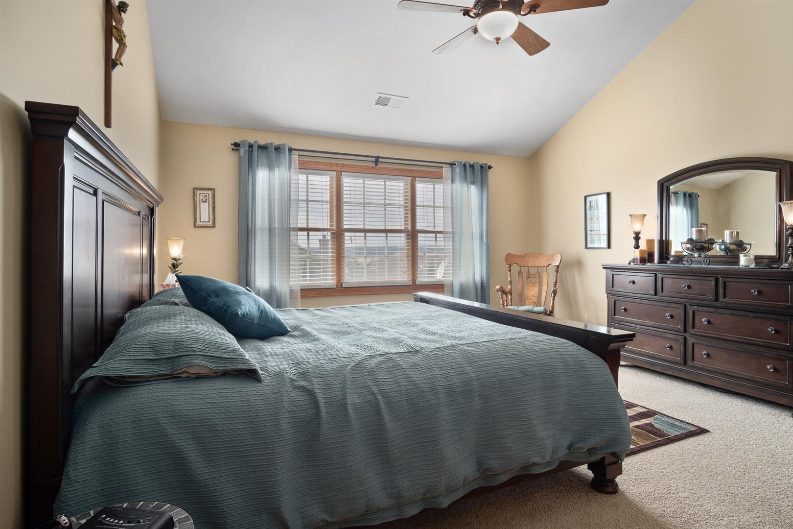 3705 Ridge Pointe Drive Geneva, IL 60134 - Photo 20 of 35 a bedroom with a bed and a dresser