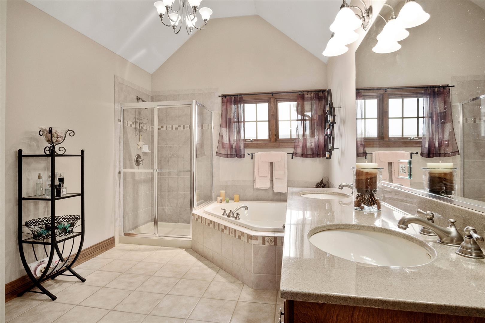 3705 Ridge Pointe Drive Geneva, IL 60134 - Photo 23 of 35 a spacious bathroom with a sink double vanity and a mirror