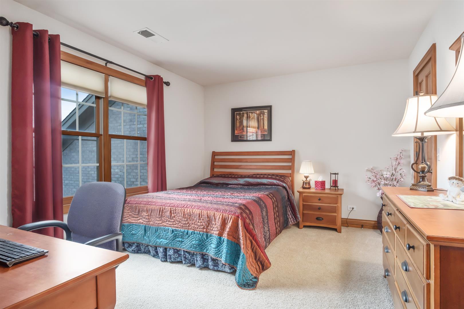 3705 Ridge Pointe Drive Geneva, IL 60134 - Photo 24 of 35 a bedroom with a bed and a desk