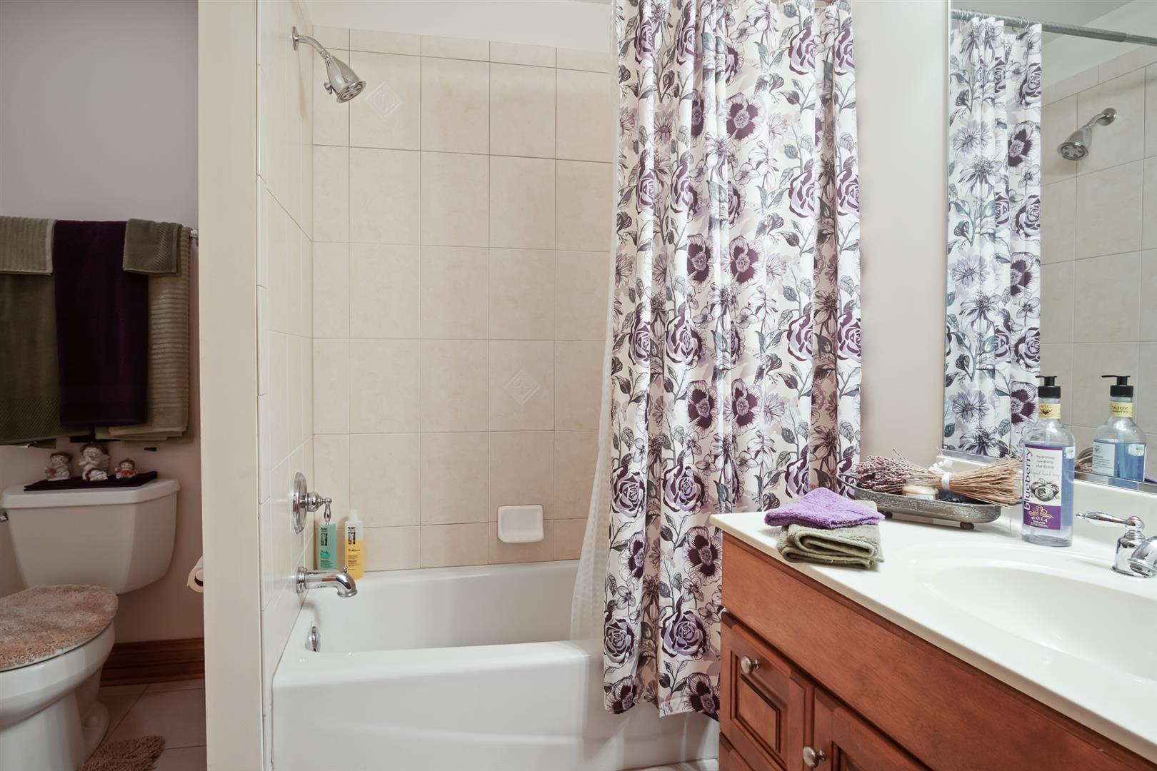 3705 Ridge Pointe Drive Geneva, IL 60134 - Photo 28 of 35 a bathroom with a sink toilet and shower