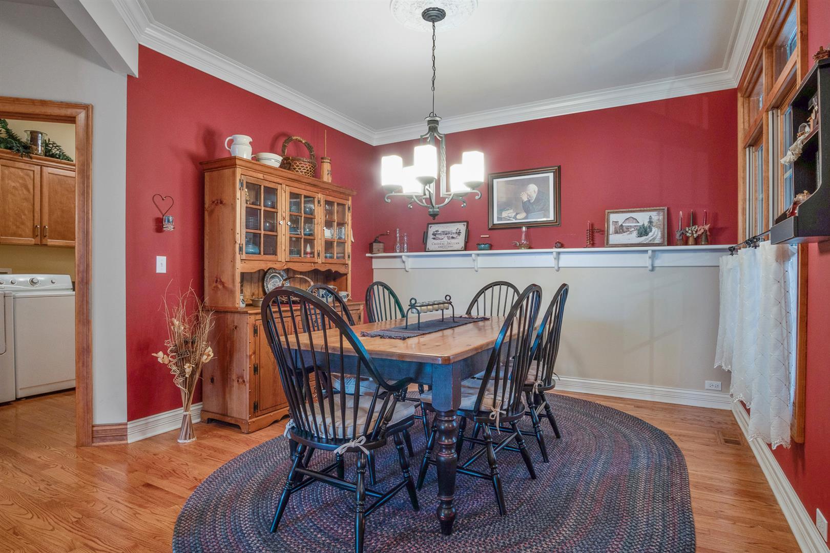 3705 Ridge Pointe Drive Geneva, IL 60134 - Photo 5 of 35 a view of a dining room with furniture and wooden floor