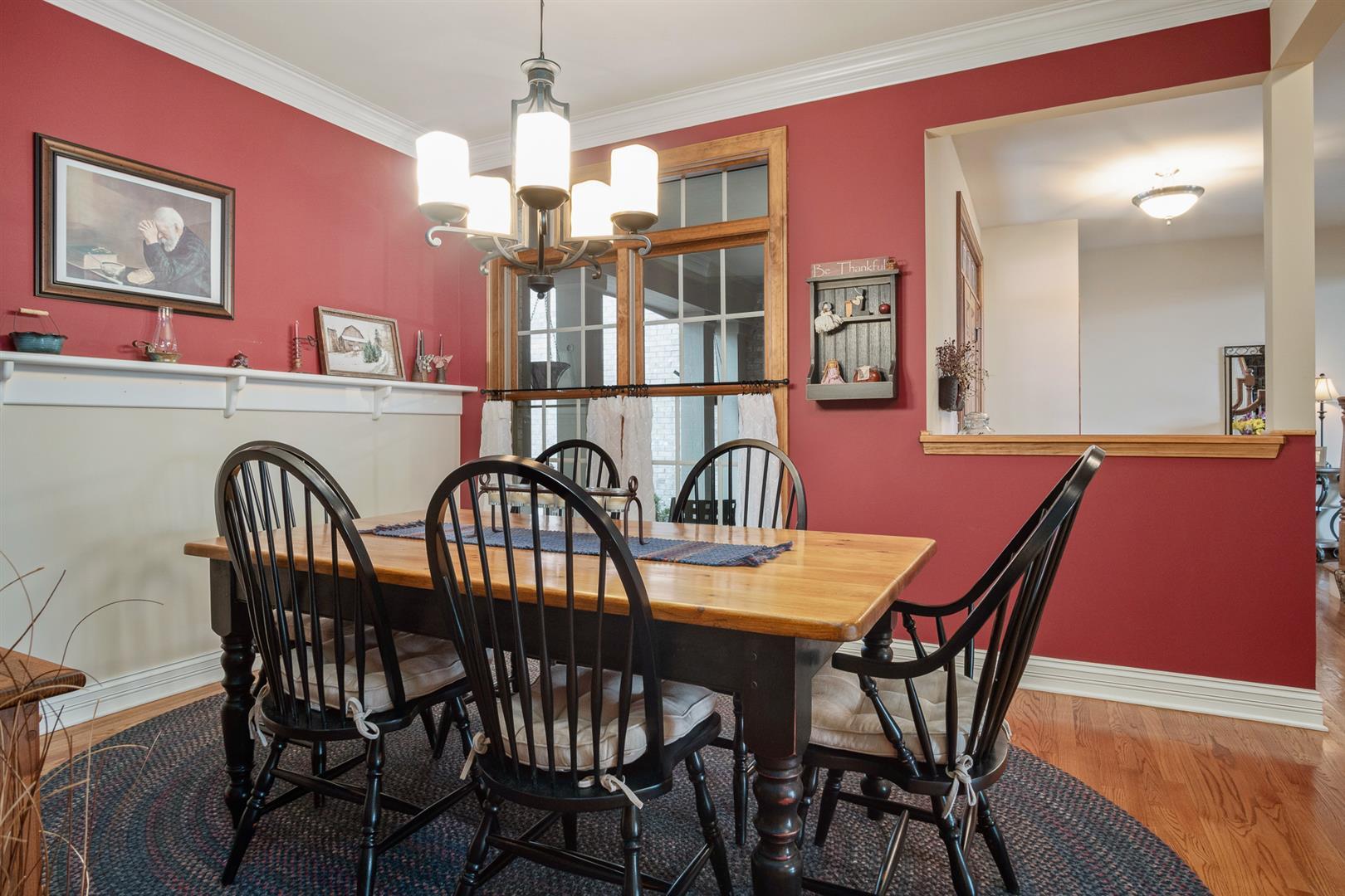 3705 Ridge Pointe Drive Geneva, IL 60134 - Photo 6 of 35 a view of a a dining room with furniture window and wooden floor