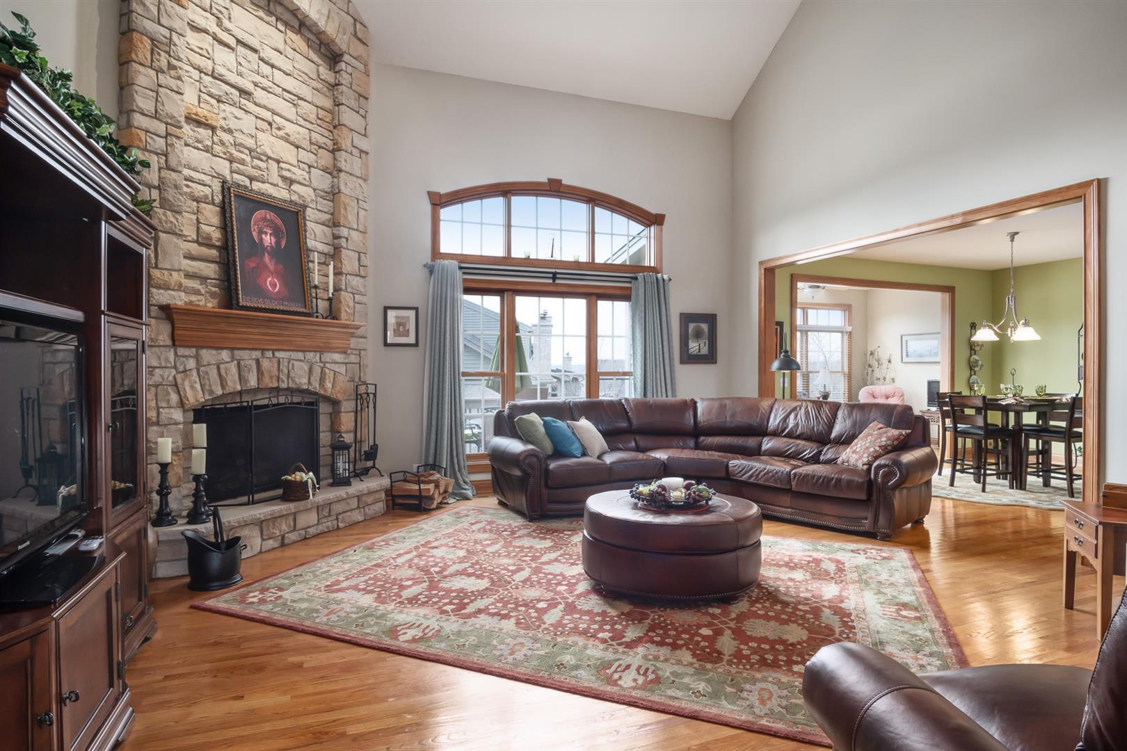 3705 Ridge Pointe Drive Geneva, IL 60134 - Photo 7 of 35 a living room with furniture large window and a fireplace