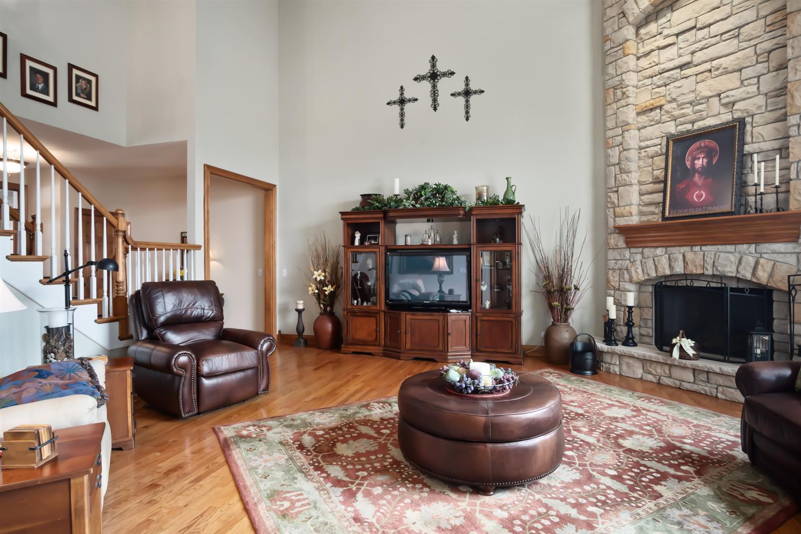3705 Ridge Pointe Drive Geneva, IL 60134 - Photo 8 of 35 a living room with furniture and a fireplace