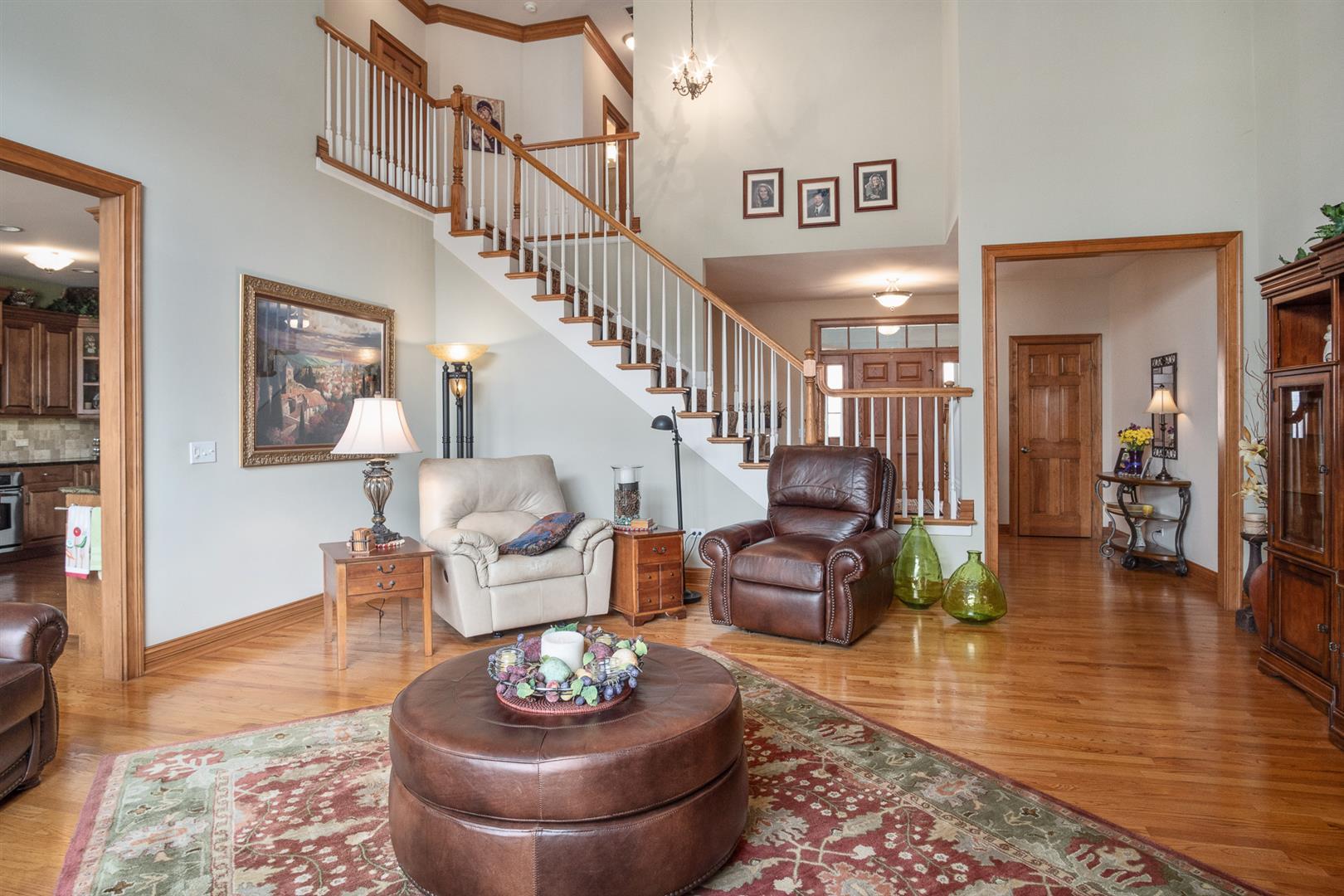 3705 Ridge Pointe Drive Geneva, IL 60134 - Photo 9 of 35 a living room with furniture and a wooden floor