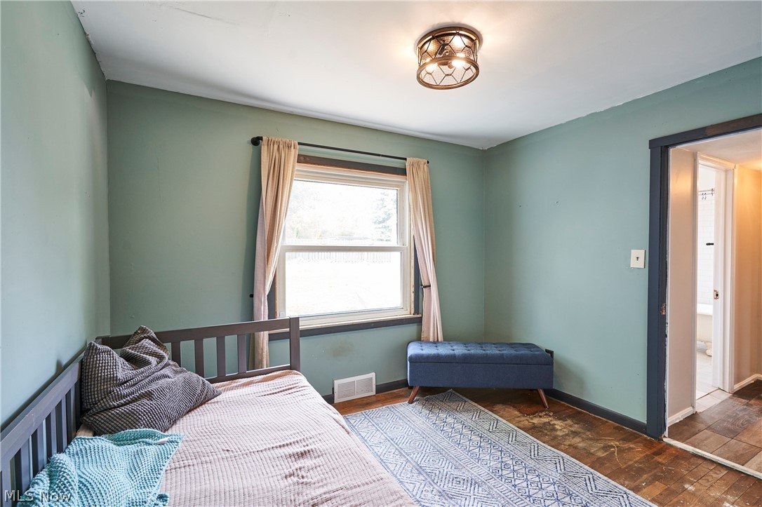 780 Bates Road Rocky River, OH 44116 - Photo 21 of 35 Spacious room featuring a single window, a flush-mount ceiling light fixture, and an open doorway