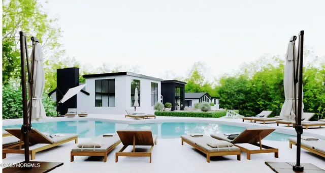 a swimming pool with outdoor seating and yard