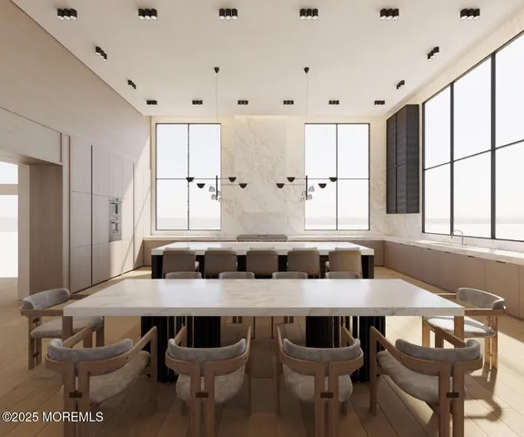 a kitchen with granite countertop a table and chairs in it