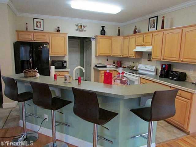 1707 Jones Road King, NC 27021 - Photo 14 of 16 Kitchen. View of this great Kitchen! Eat in bar in the island, tons cabinets, all appliances remain!