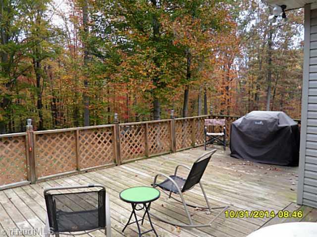 1707 Jones Road King, NC 27021 - Photo 4 of 16 Patio/Deck. Huge deck overlooking great yard, beautiful wooded land behind and on both sides!