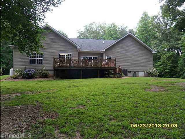 1707 Jones Road King, NC 27021 - Photo 7 of 16 Exterior Back. View of the back of this gorgeous home overlooking 6 beautiful acres, creek & more!