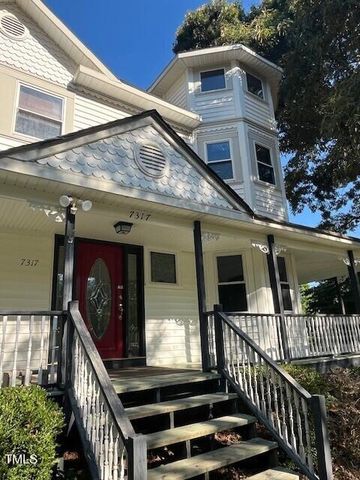 a view of a house with large windows