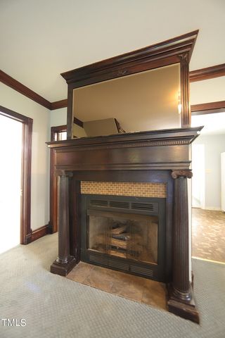 a living room with a fireplace
