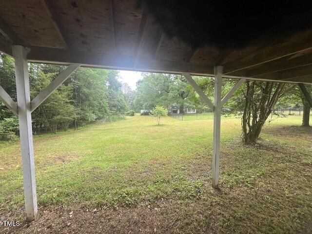 a view of a yard with a tree