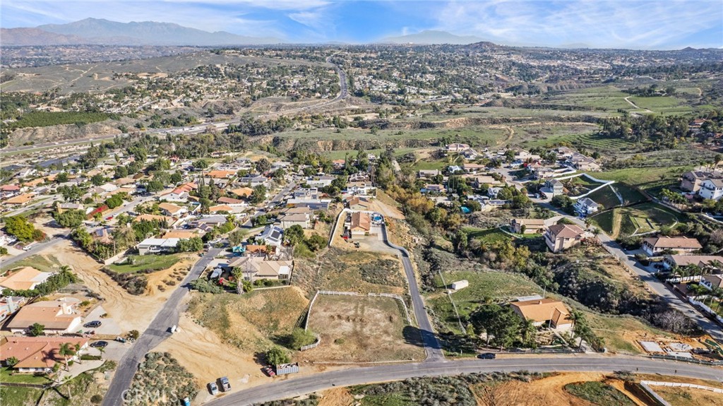 16538 Canyon Ridge Drive Riverside, CA 92503 - Photo 10 of 13 an aerial view of residential houses with outdoor space and trees