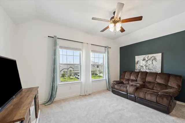 a living room with furniture and a window