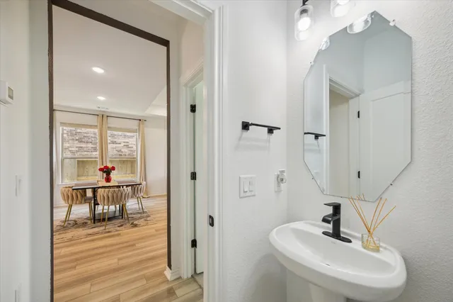 a bathroom with a sink and mirror