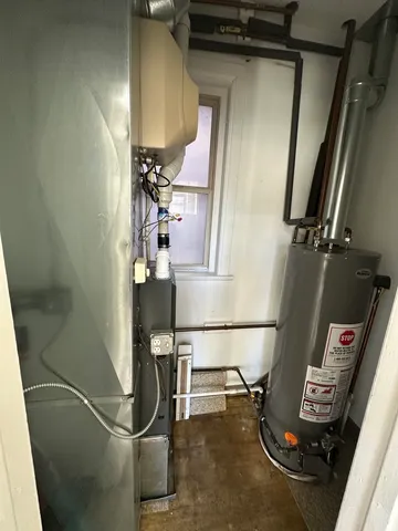 a kitchen with stainless steel appliances a stove a sink and a refrigerator