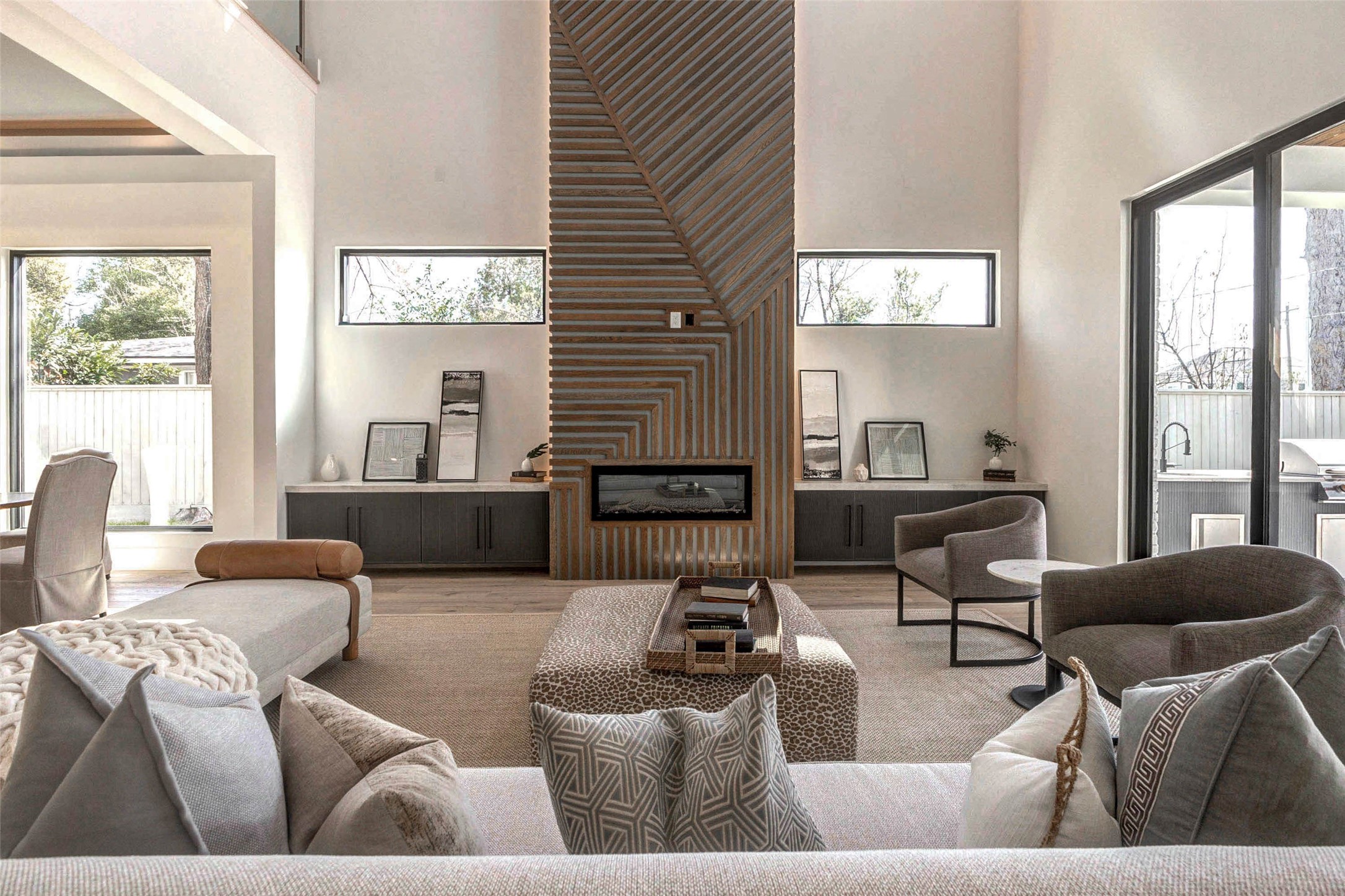 207 West 33rd Street Houston, TX 77018 - Photo 4 of 50 Dramatic 22-foot LED fireplace serves as a stunning focal point in the family room, adding both warmth and modern sophistication.