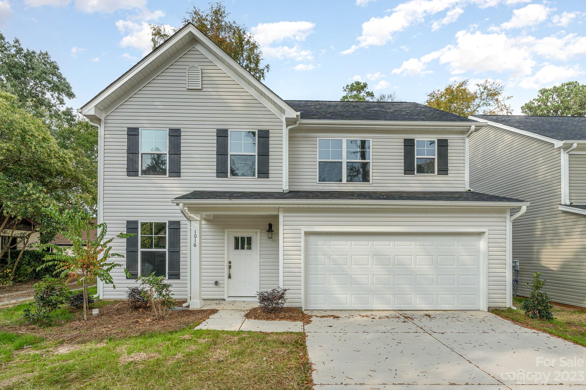 1016 Helms Road Charlotte, NC 28214 - Photo 1 of 39 front view of a house with a yard