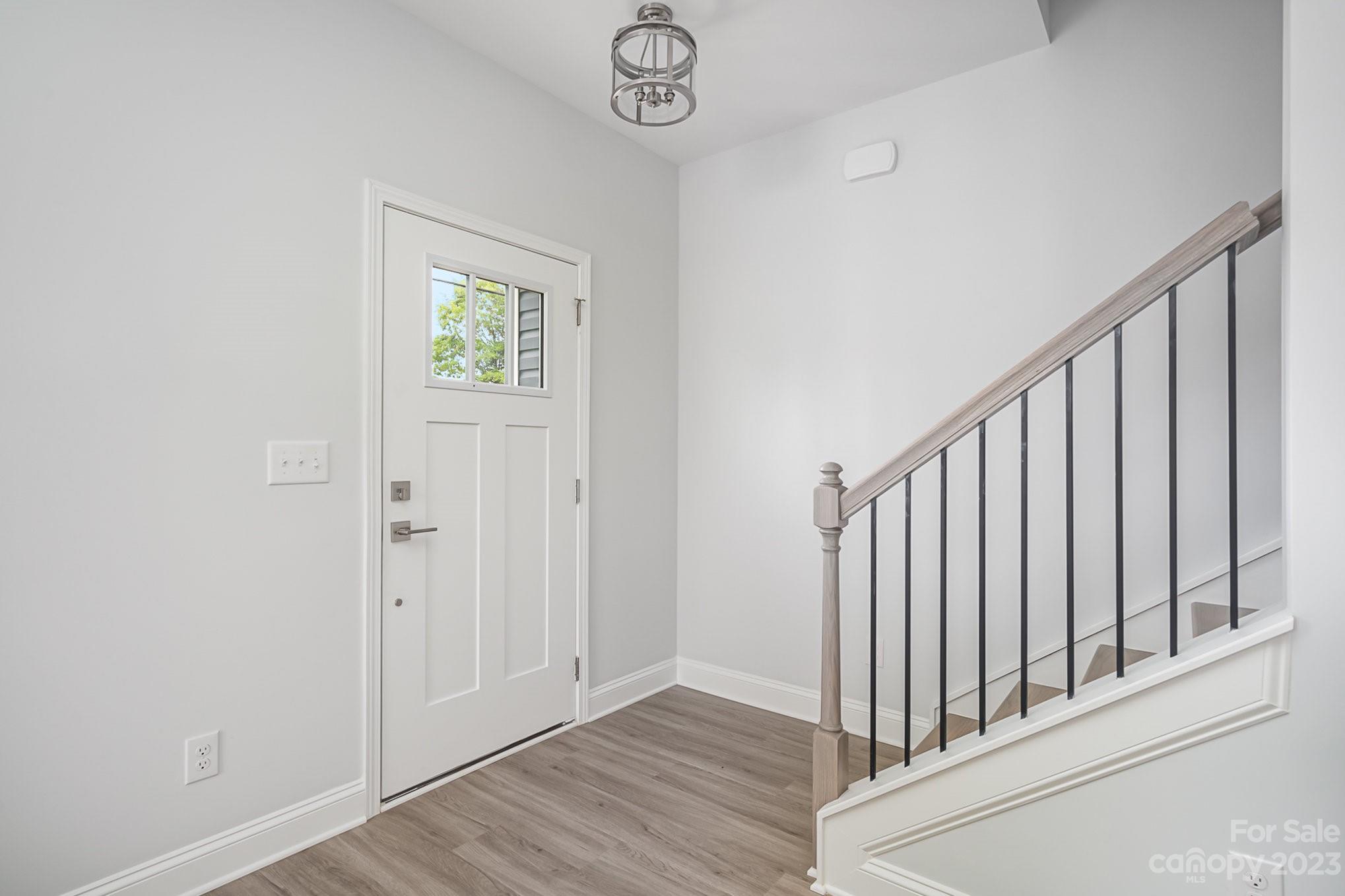 1016 Helms Road Charlotte, NC 28214 - Photo 18 of 39 a view of an entryway with wooden floor