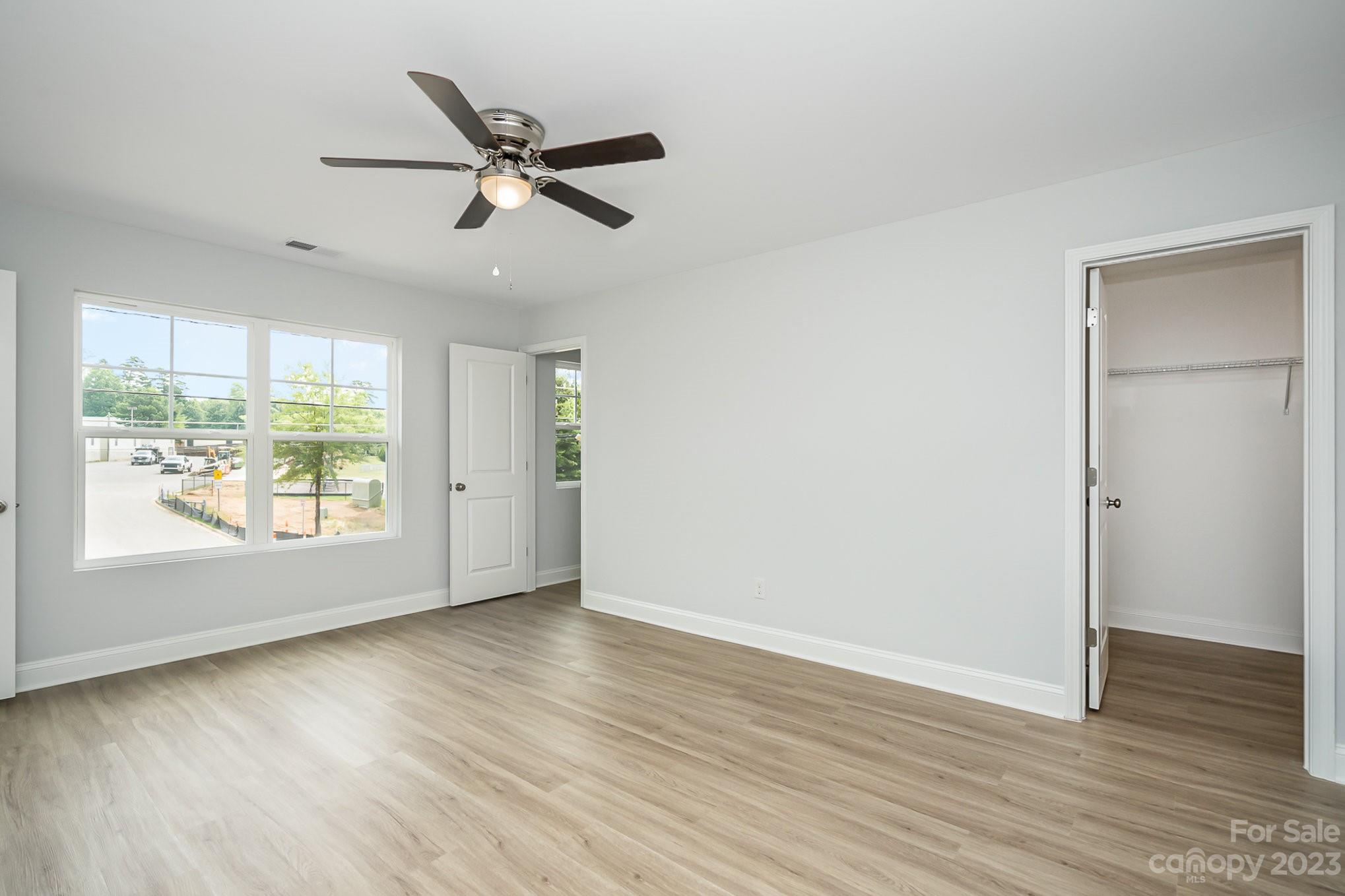 1016 Helms Road Charlotte, NC 28214 - Photo 21 of 39 a view of an empty room with wooden floor and a window