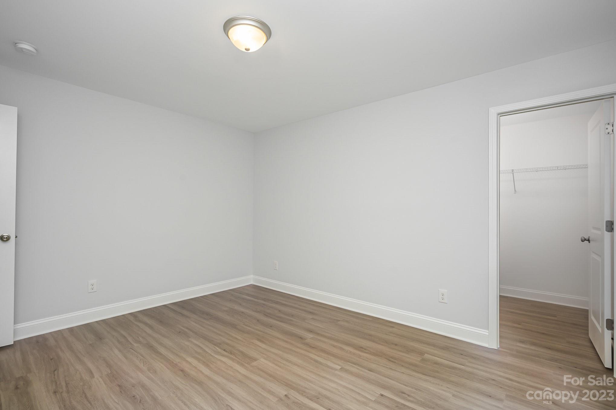 1016 Helms Road Charlotte, NC 28214 - Photo 31 of 39 wooden floor in an empty room