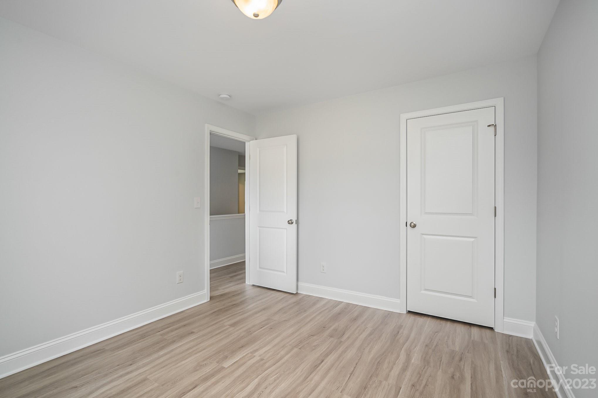 1016 Helms Road Charlotte, NC 28214 - Photo 33 of 39 a view of an empty room and wooden floor