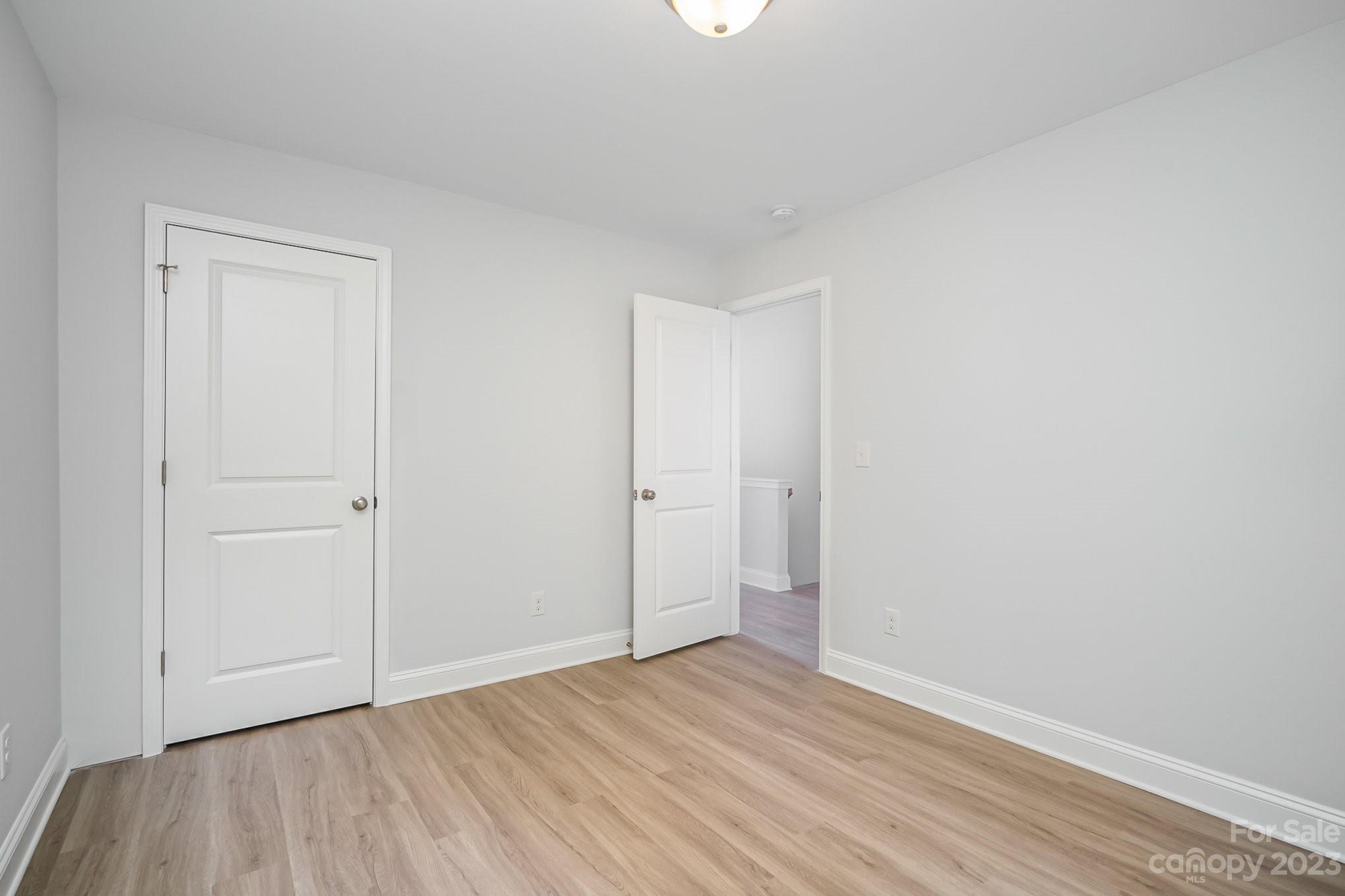 1016 Helms Road Charlotte, NC 28214 - Photo 34 of 39 a view of an empty room and wooden floor