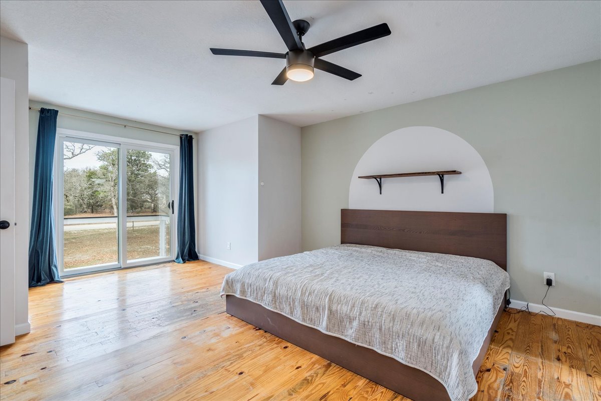 171 Pin Oak Crossing Elgin, TX 78621 - Photo 23 of 39 Unfurnished primary bedroom w/ balcony
