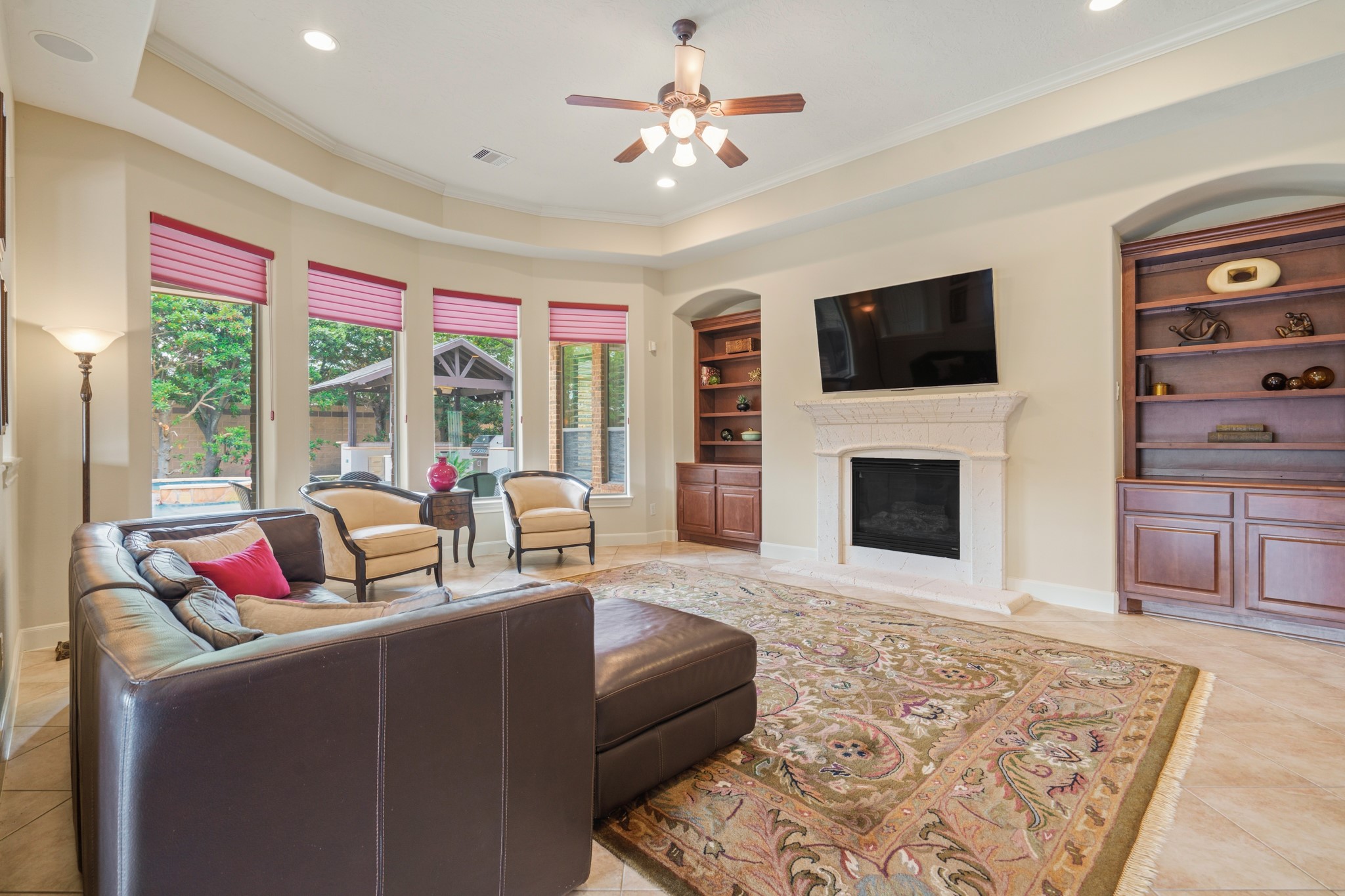 7303 Starry Night Katy, TX 77494 - Photo 18 of 49 Built in book cases on each side of the cast stone fire place.