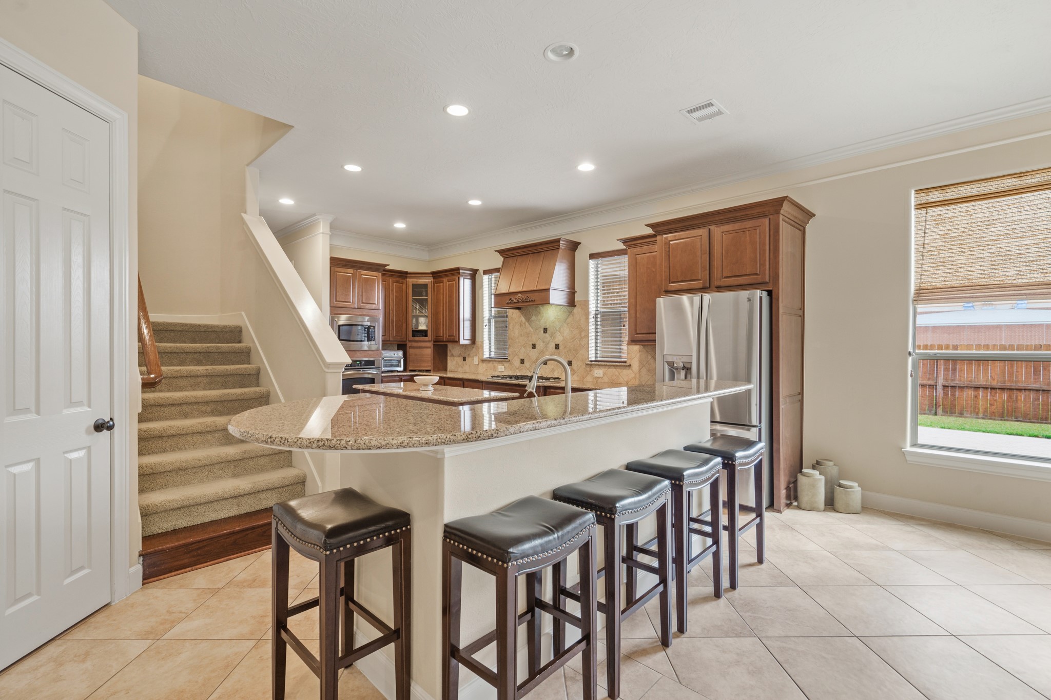 7303 Starry Night Katy, TX 77494 - Photo 20 of 49 Second staircase to the kitchen with island seating for 5!
