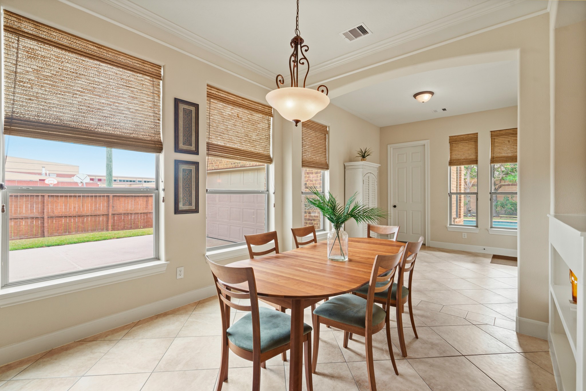 7303 Starry Night Katy, TX 77494 - Photo 21 of 49 Breakfast area offers additional sunroom space towards the back patio door and built in shelves on the half wall.