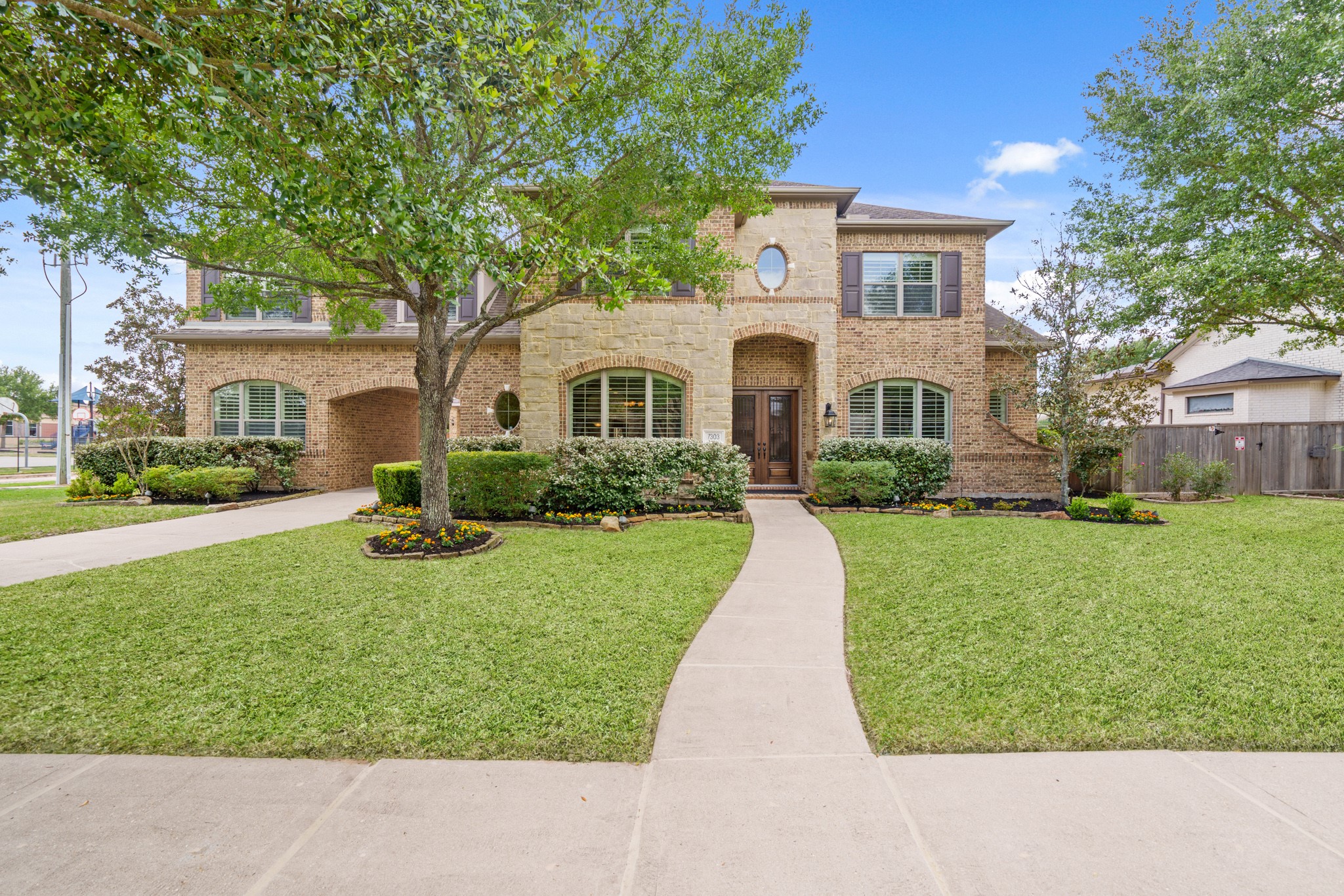 7303 Starry Night Katy, TX 77494 - Photo 3 of 49 Welcome home! Located at the end of the tree lined street next door to the Elementary.