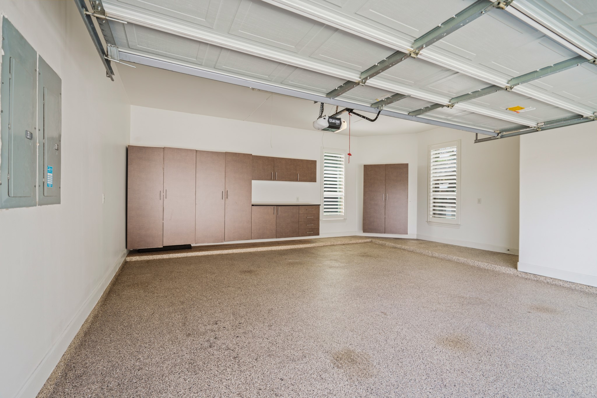 7303 Starry Night Katy, TX 77494 - Photo 45 of 49 Enjoy 2 of the 3 car garage on one bay with a third car single bay. Owners had custom built-in cabinets added to the 2 car garage and epoxy floors in all garages!
