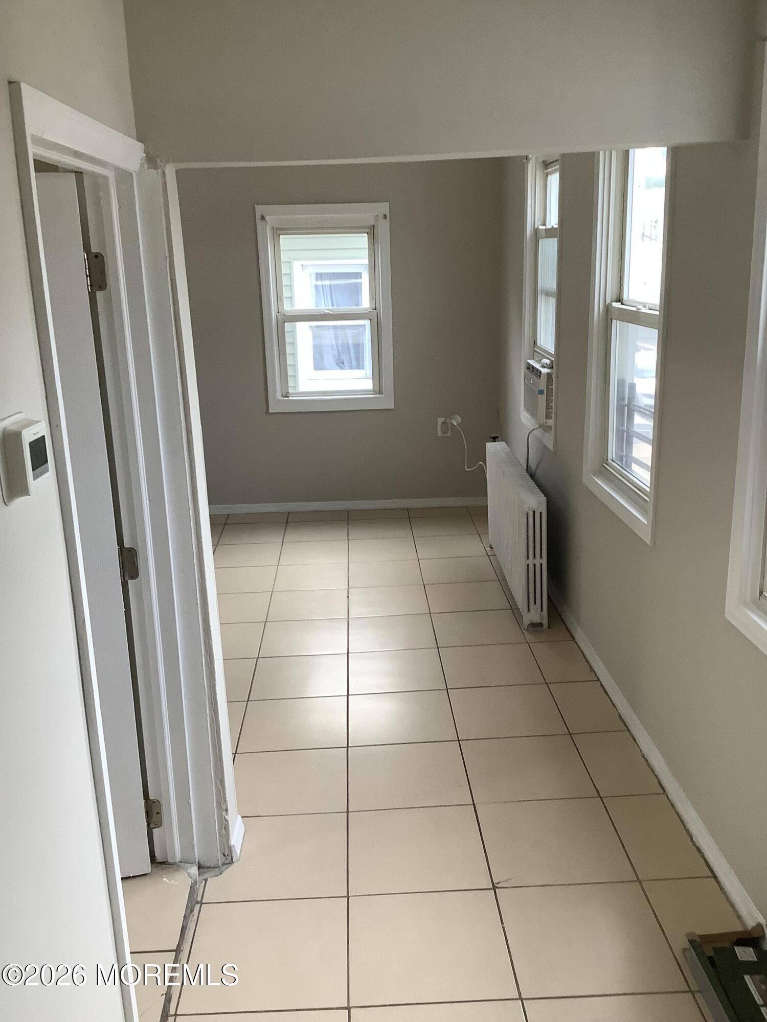 242 1st Street Keyport, NJ 07735 - Photo 15 of 23 a view of an empty room with windows