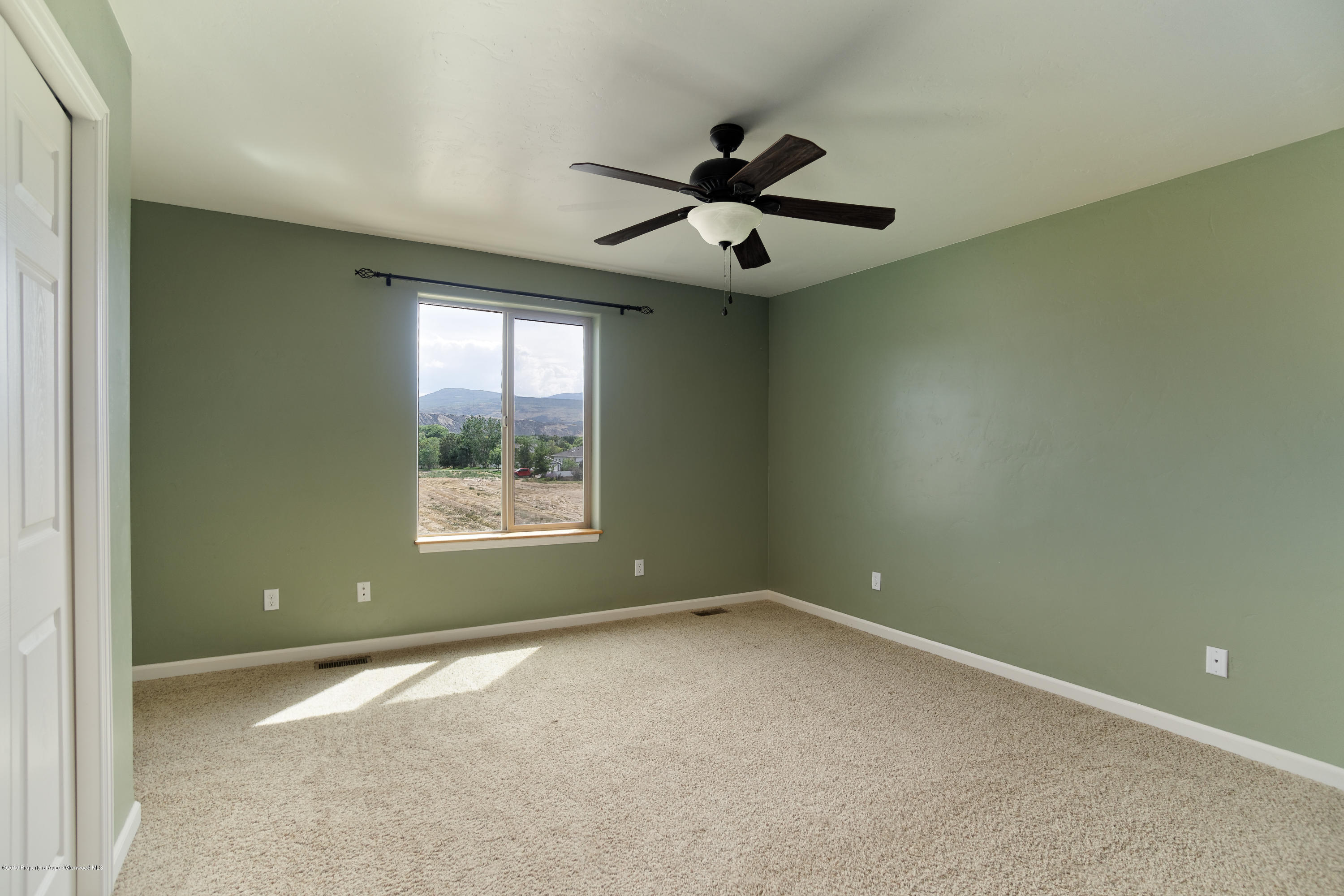973 East 17th Street Rifle, CO 81650 - Photo 10 of 19 a view of an empty room with a window