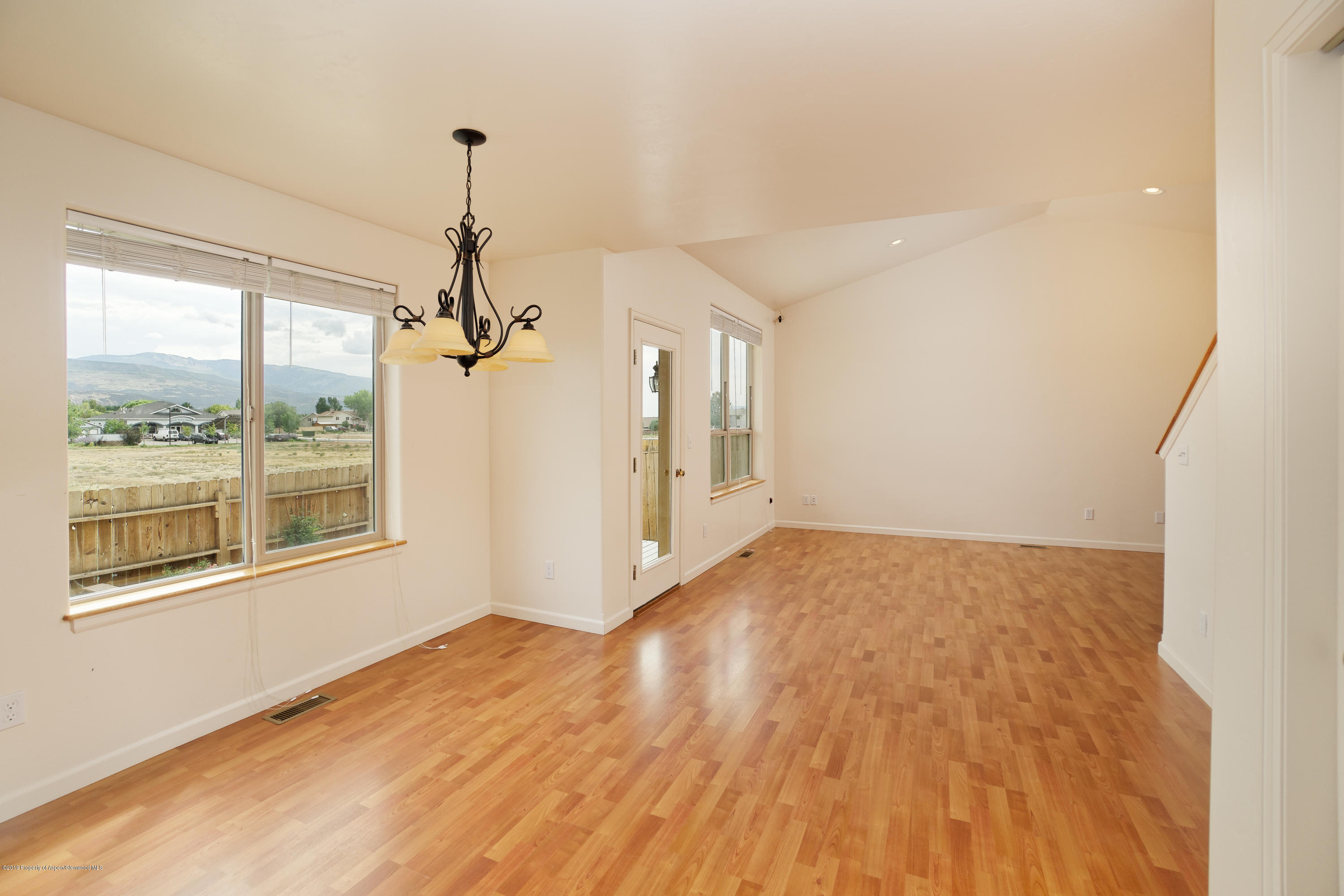 973 East 17th Street Rifle, CO 81650 - Photo 6 of 19 a view of empty room with wooden floor and fan